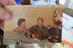 Stanford Chicoyne showing me a picture of Keith and his cousin Vera Chicoyne singing together. (Photo by Glenn Patterson)